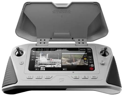 Compact white and grey ground control station with a built-in screen and dual joysticks